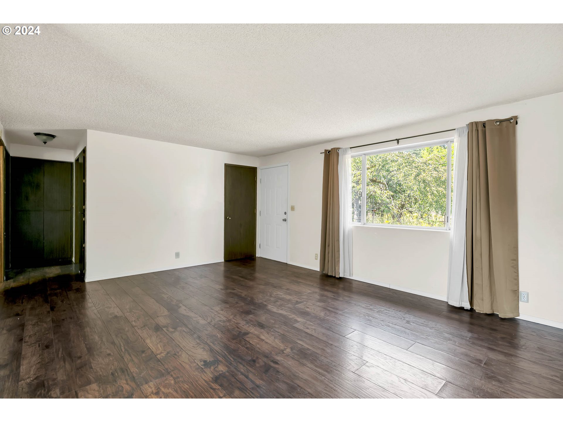 6112 Main Street Springfield, OR 97478 - Photo 36 of 47 a view of an empty room with wooden floor and a window