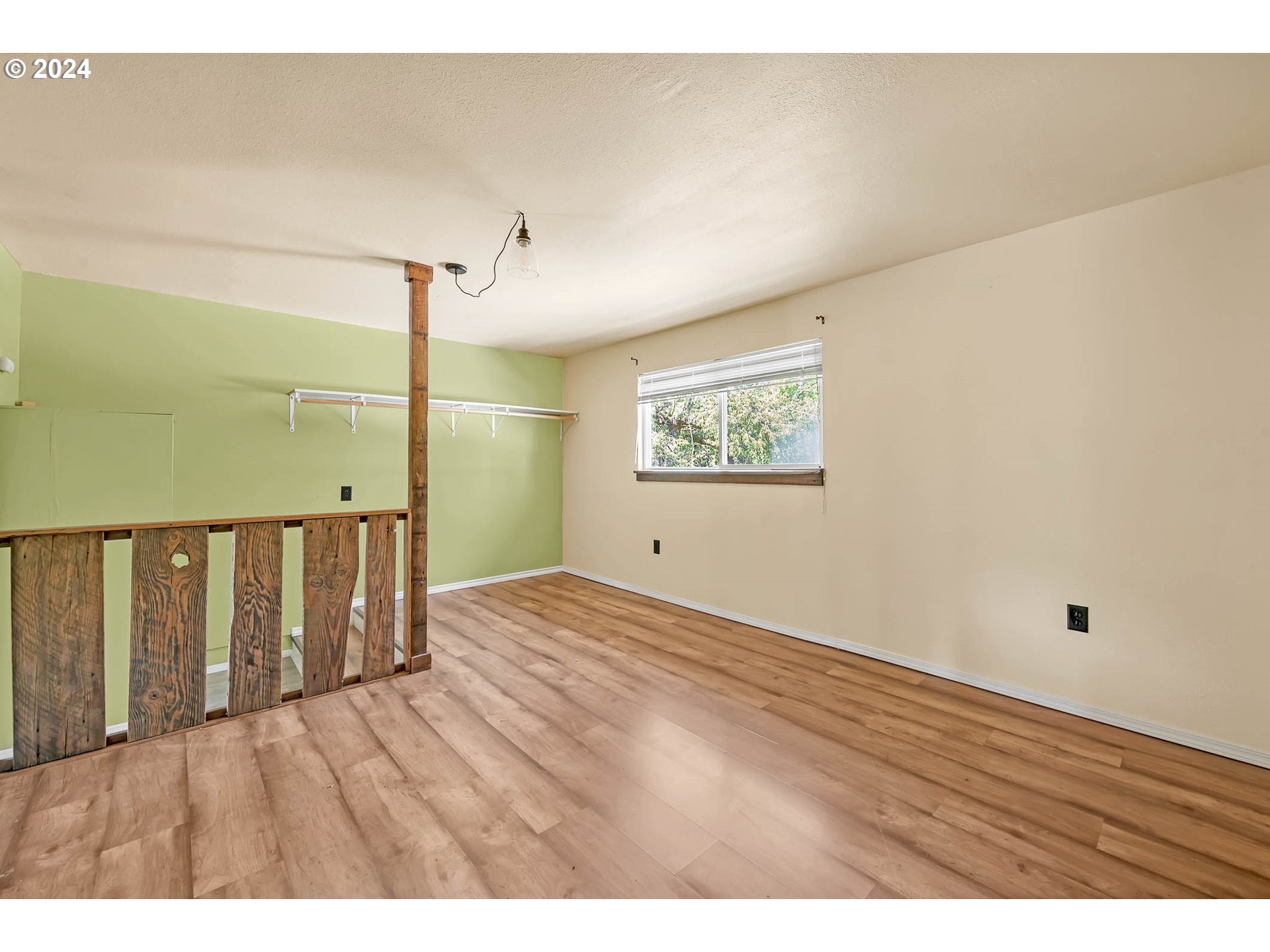 6112 Main Street Springfield, OR 97478 - Photo 43 of 47 a view of an empty room with wooden floor and a window