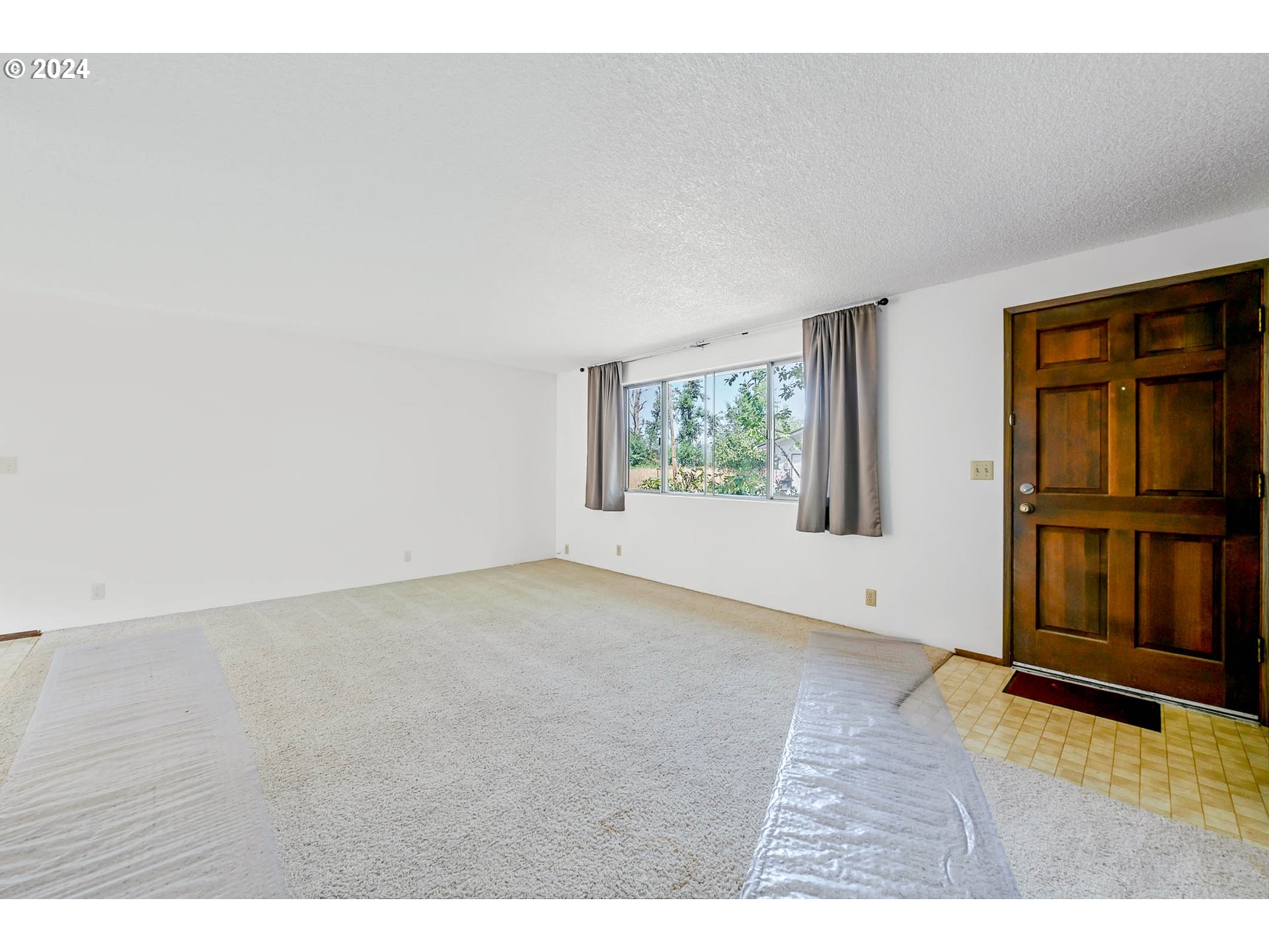 6112 Main Street Springfield, OR 97478 - Photo 6 of 47 a view of an empty room with a window