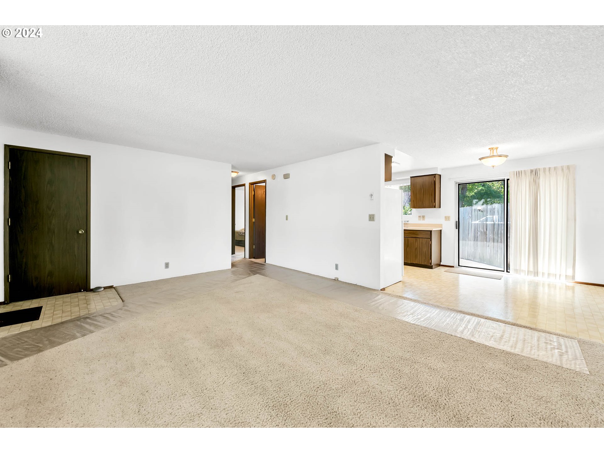 6112 Main Street Springfield, OR 97478 - Photo 7 of 47 a view of an empty room with a window