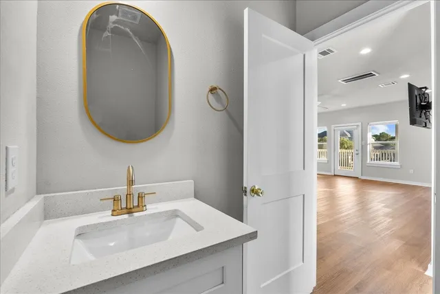 a bathroom with a sink and a mirror