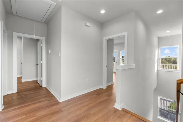wooden floor in a hall with an entryway