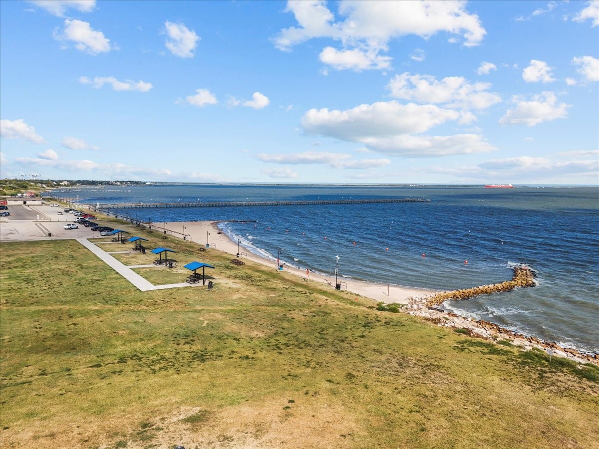 101 Grove Street La Porte, TX 77571 - Photo 4 of 26 a view of a swimming pool with an outdoor seating and a yard