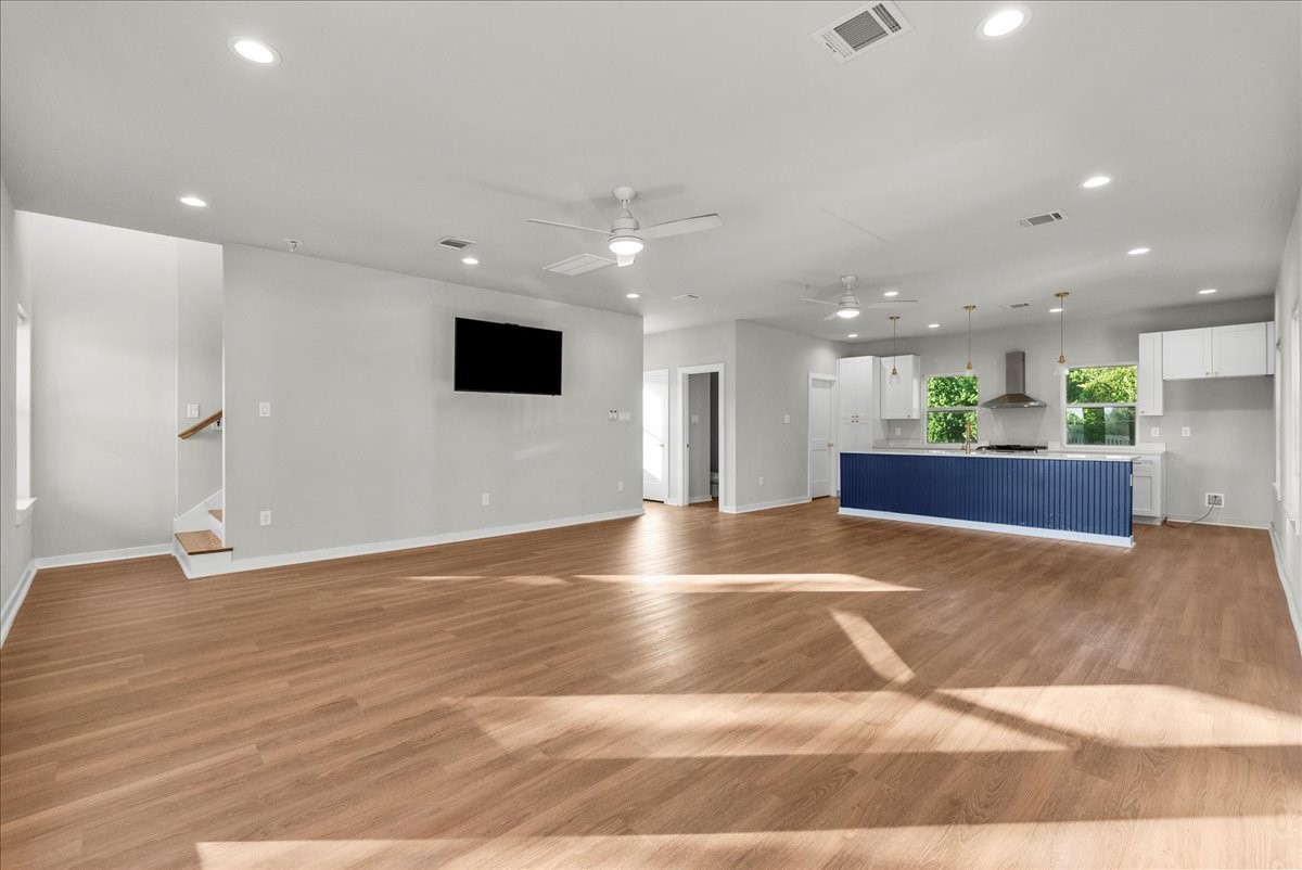 101 Grove Street La Porte, TX 77571 - Photo 9 of 26 a view of kitchen and empty room with wooden floor