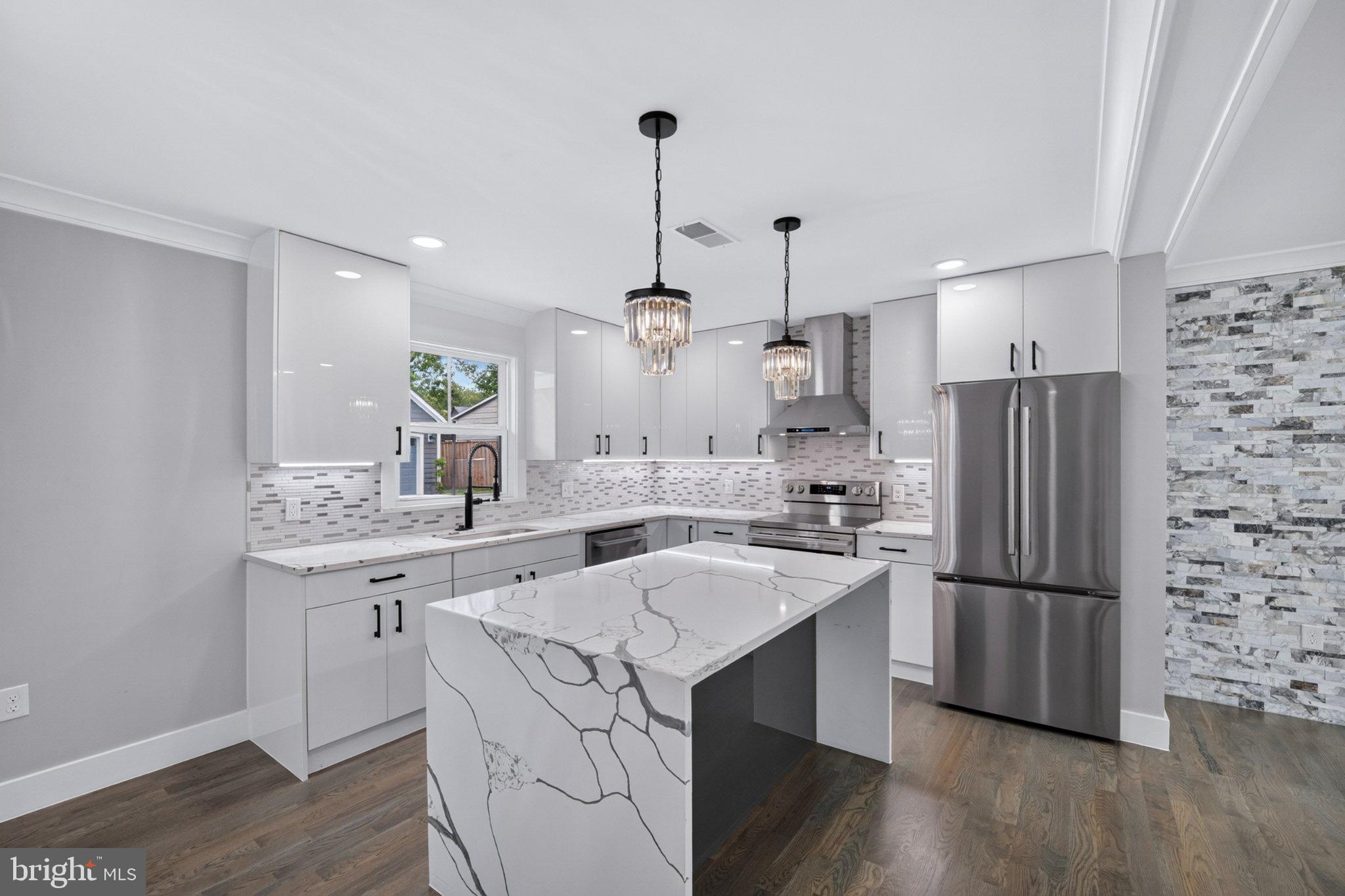 8323 Rolling Road Manassas, VA 20110 - Photo 25 of 97 Sleek modern kitchen with elegant finishes.