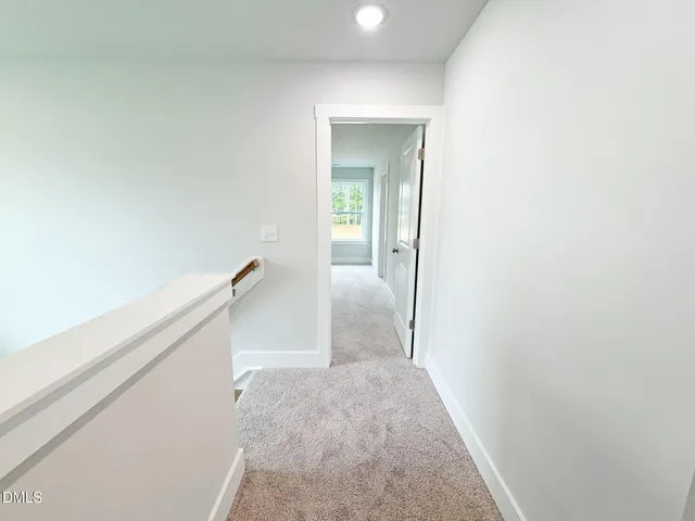 a view of a bedroom from the hallway