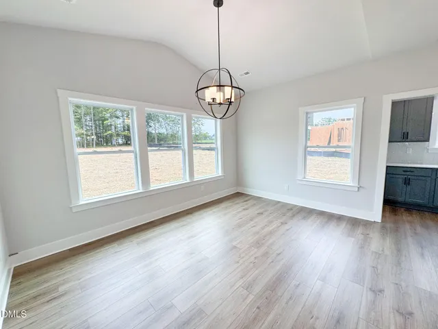 a kitchen with a sink a stove and cabinets