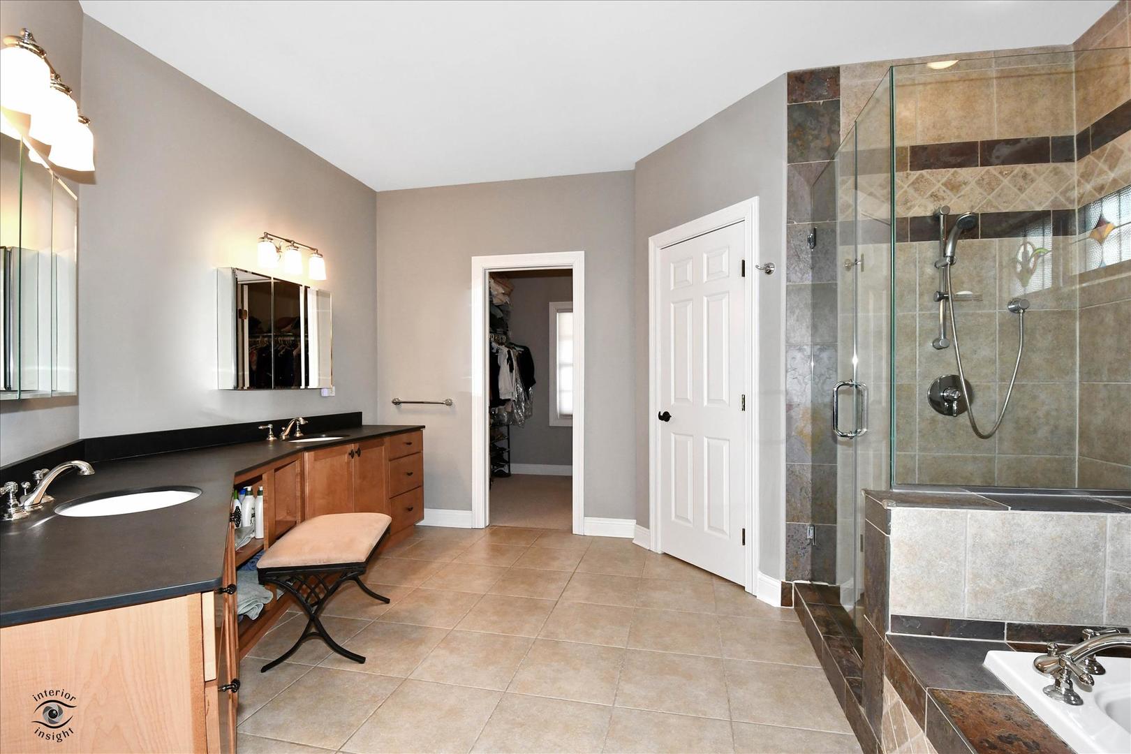 617 Hillside Road Glenview, IL 60025 - Photo 16 of 46 a view of a bathroom with a sink mirror and window