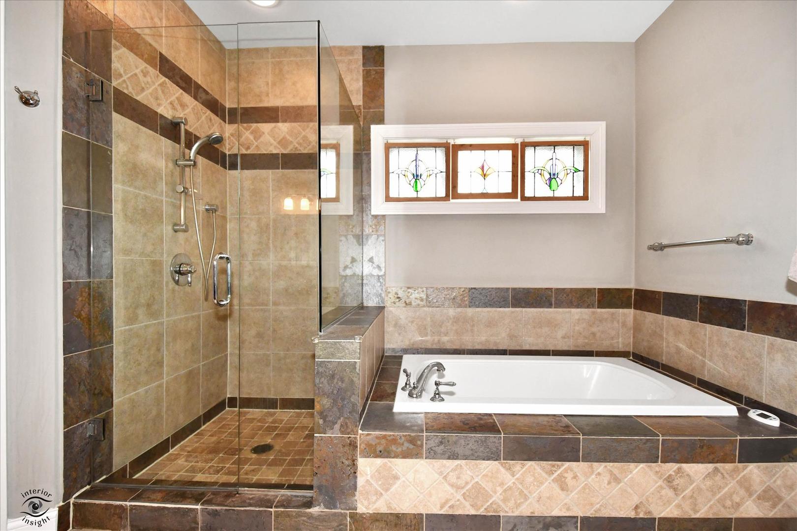 617 Hillside Road Glenview, IL 60025 - Photo 18 of 46 a bathroom with a bathtub and a shower
