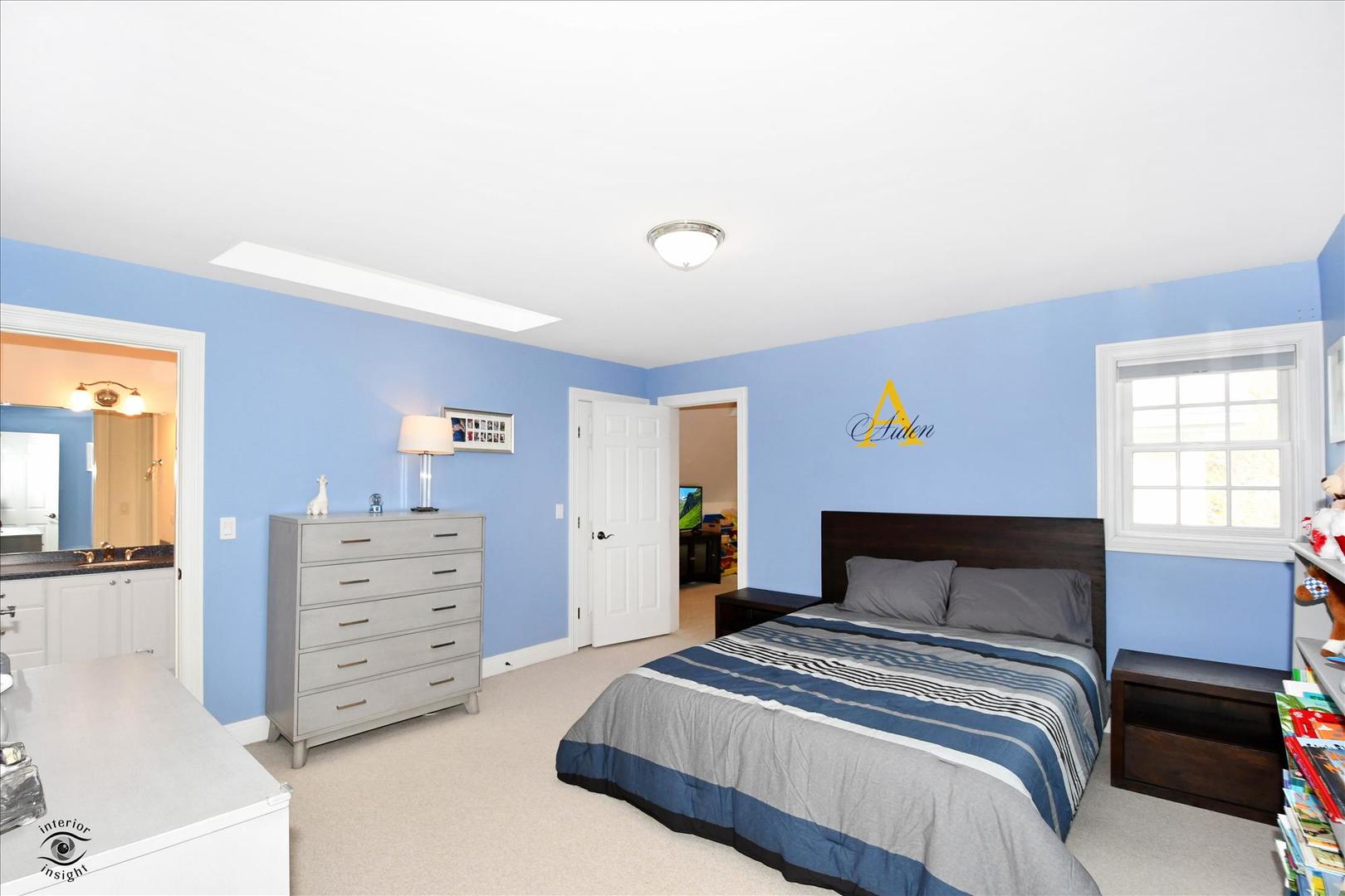 617 Hillside Road Glenview, IL 60025 - Photo 20 of 46 a bedroom with a bed and window