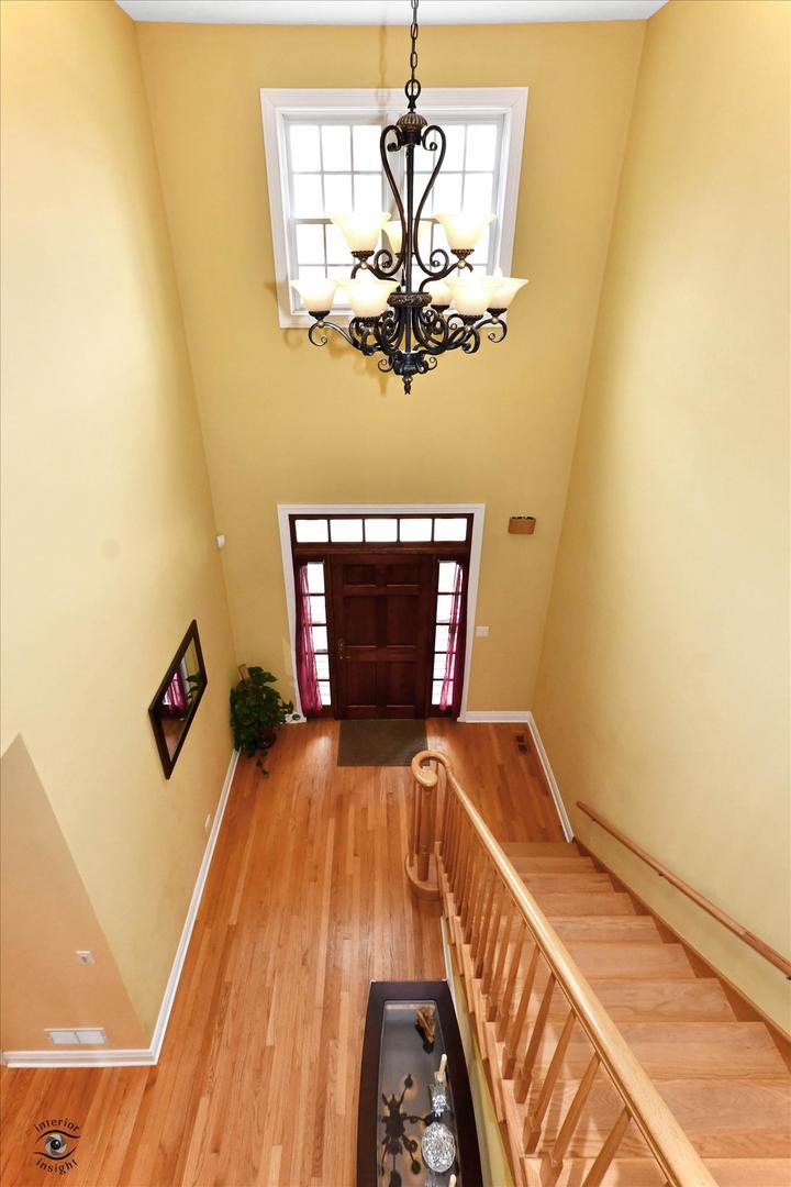 617 Hillside Road Glenview, IL 60025 - Photo 3 of 46 a bedroom with a bed and ceiling fan