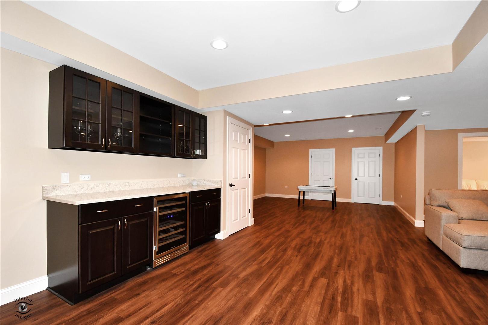 617 Hillside Road Glenview, IL 60025 - Photo 33 of 46 a view of an empty room with wooden floor and a window