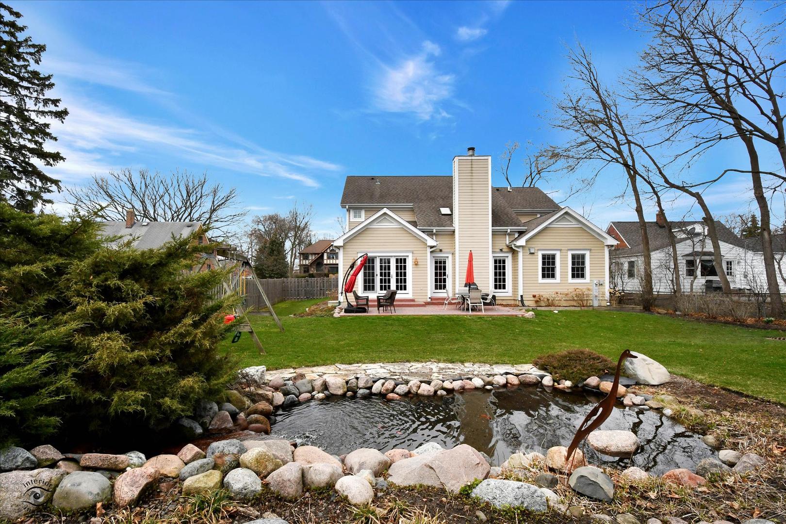 617 Hillside Road Glenview, IL 60025 - Photo 41 of 46 a view of a house with a yard and a garden