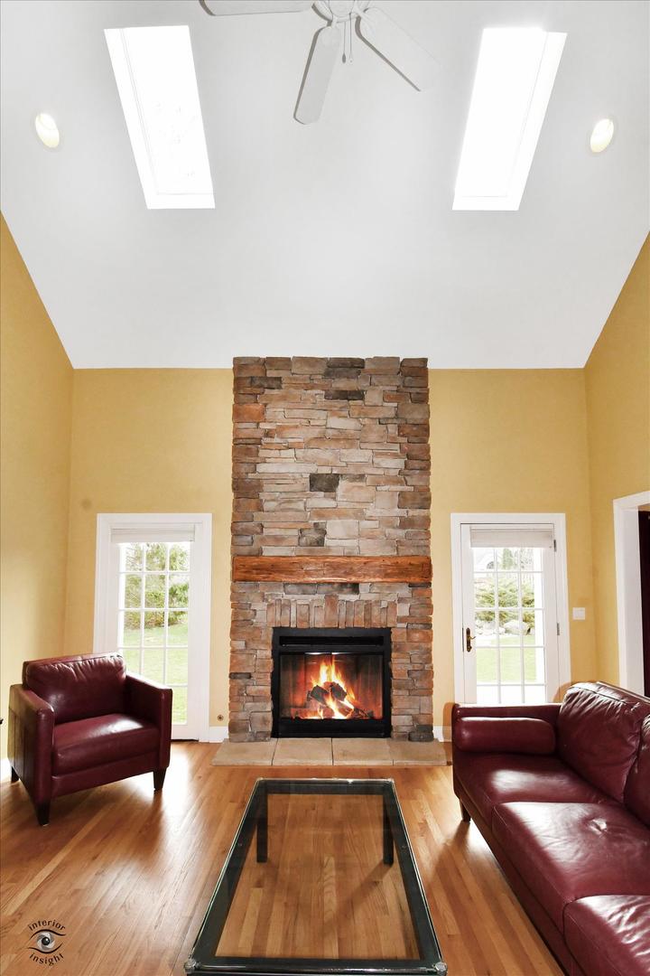 617 Hillside Road Glenview, IL 60025 - Photo 6 of 46 a living room with furniture and a fireplace