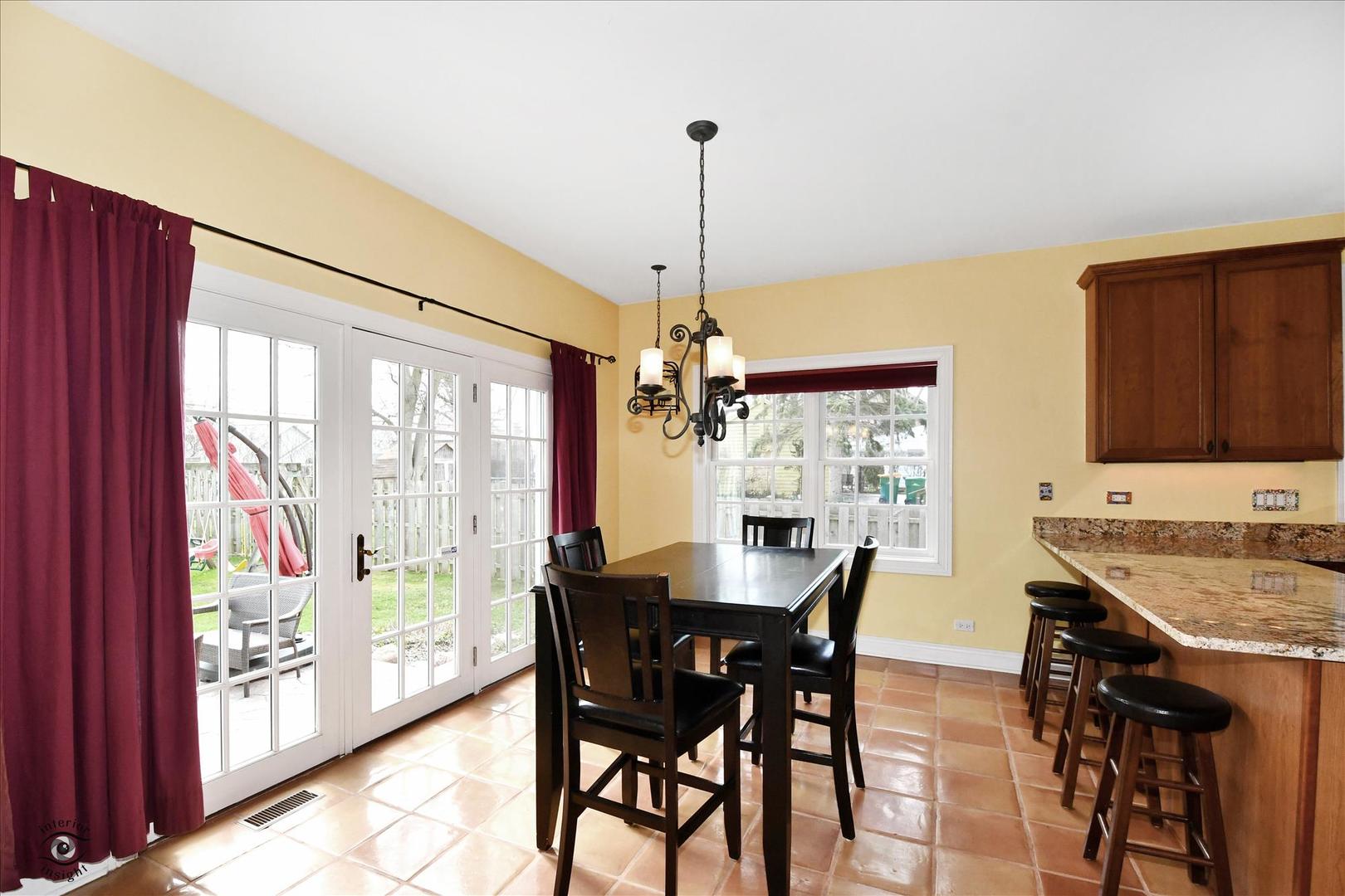 617 Hillside Road Glenview, IL 60025 - Photo 7 of 46 a view of a dining room with furniture window and outside view