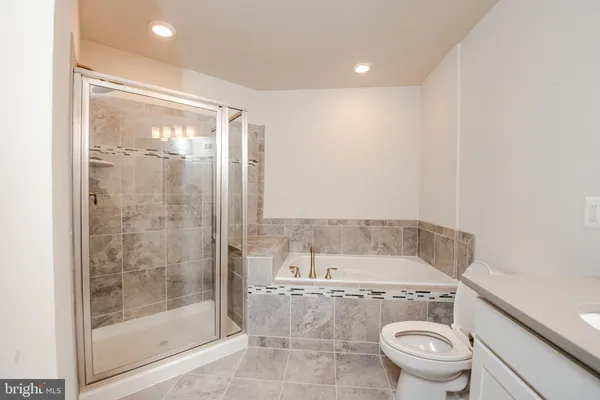 a view of bathroom with a shower and toilet