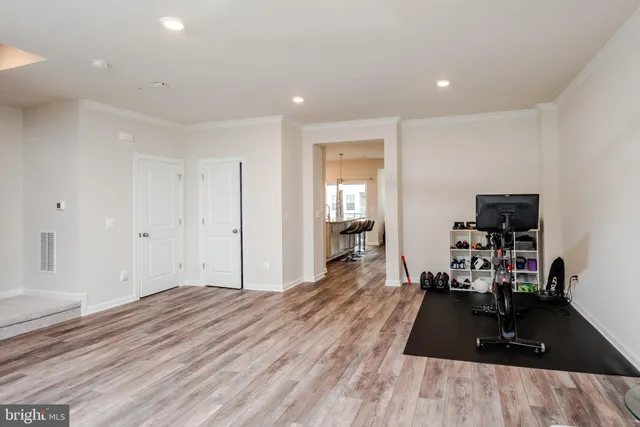 a room with wooden floor and furniture