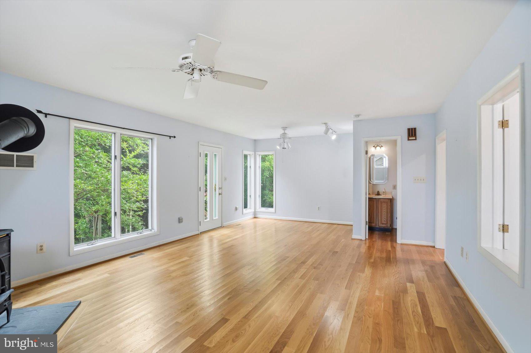 24 Normal Terrace Baltimore, MD 21286 - Photo 17 of 37 a view of an empty room with a window and wooden floor
