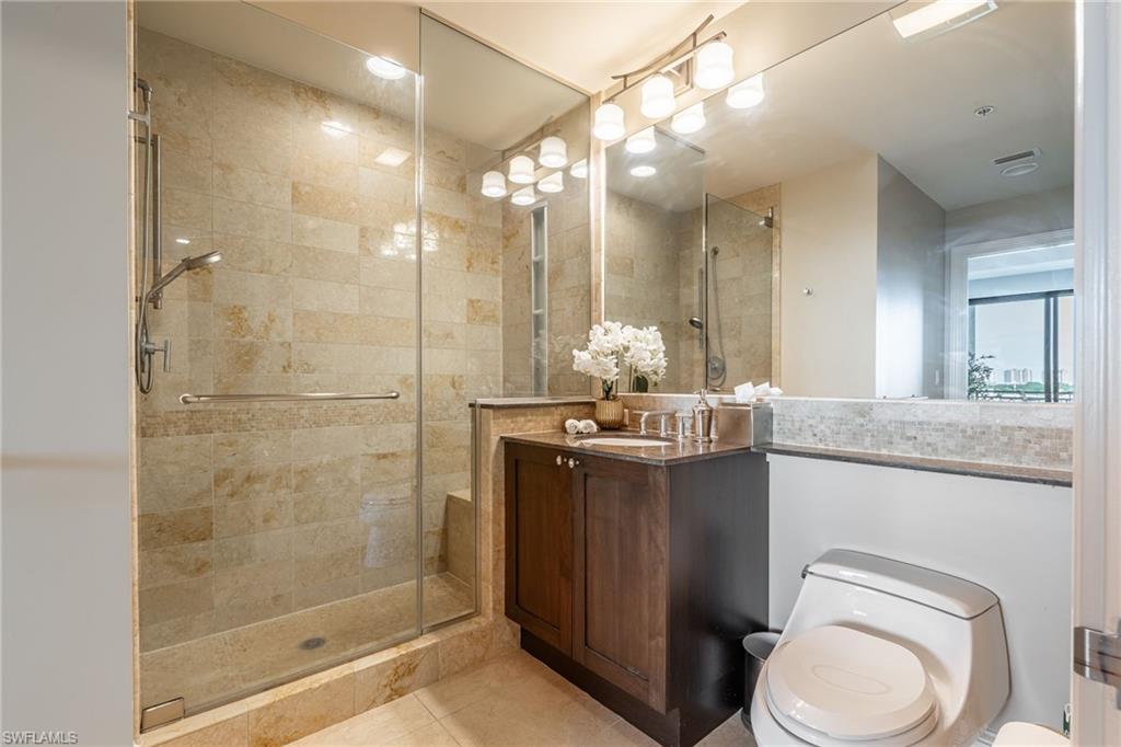9115 Strada Place, Unit 5506 Naples, FL 34108 - Photo 14 of 46 Full bathroom featuring a shower stall, vanity, tile patterned floors, and recessed lighting