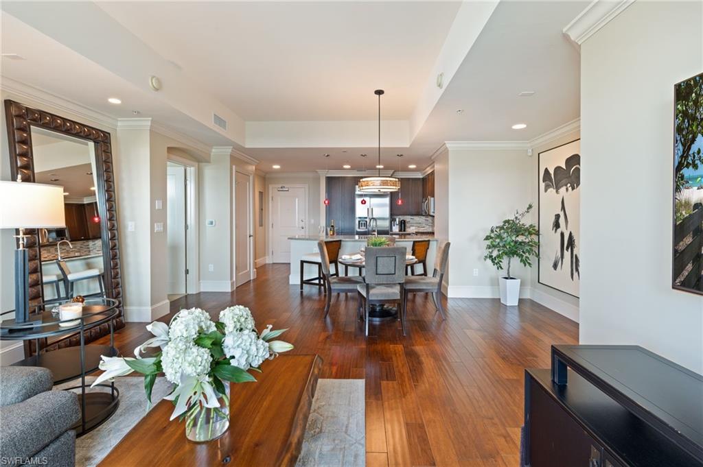 9115 Strada Place, Unit 5506 Naples, FL 34108 - Photo 17 of 46 Living room with crown molding, dark wood-style flooring, and recessed lighting