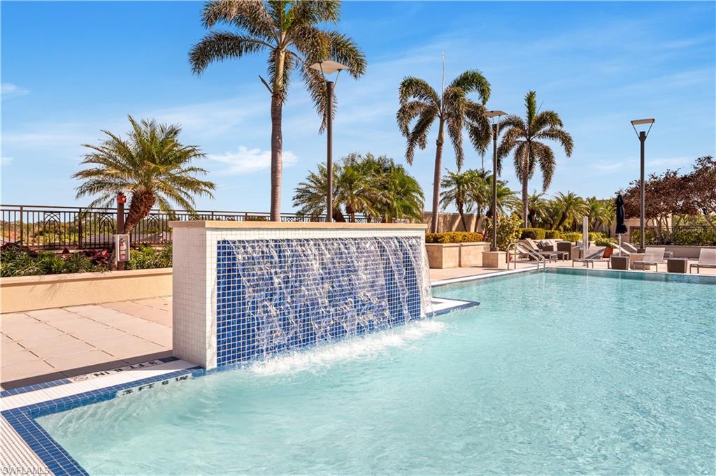 9115 Strada Place, Unit 5506 Naples, FL 34108 - Photo 32 of 46 Community pool featuring a patio