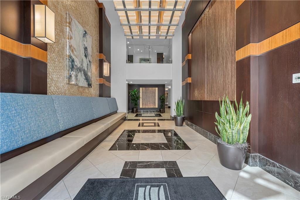 9115 Strada Place, Unit 5506 Naples, FL 34108 - Photo 40 of 46 Reception with a towering ceiling