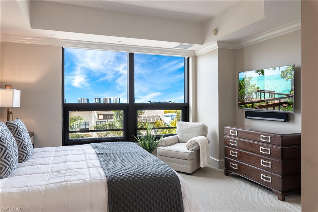 9115 Strada Place, Unit 5506 Naples, FL 34108 - Photo 9 of 46 Primary Bedroom featuring Natural Light