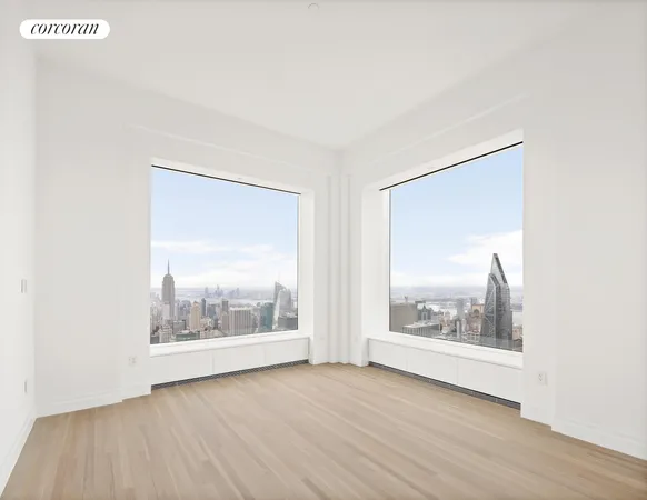 a bedroom with a bed and a large window with outer view