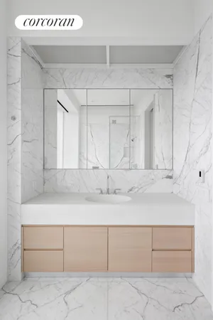 a spacious bathroom with a tub sink and mirror