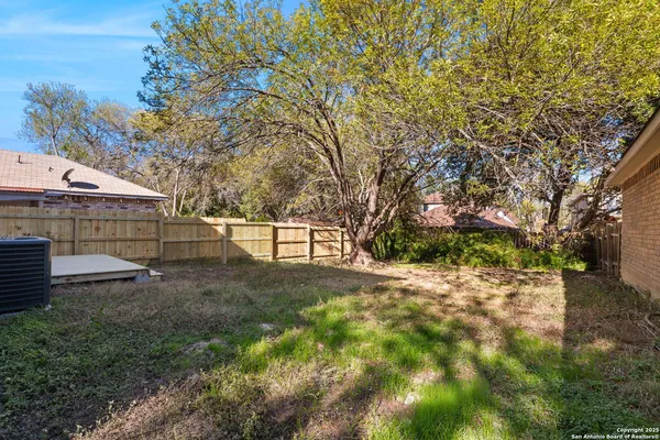 a view of backyard with green space