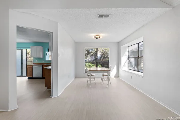 a view of a livingroom with furniture and a window