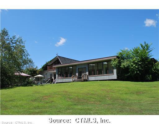 a view of a house with a big yard