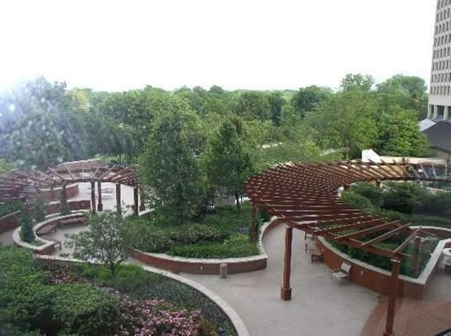 5415 North Sheridan Road, Unit 1715 Chicago, IL 60640 - Photo 22 of 24 a view of a patio with a table chairs and a fire pit