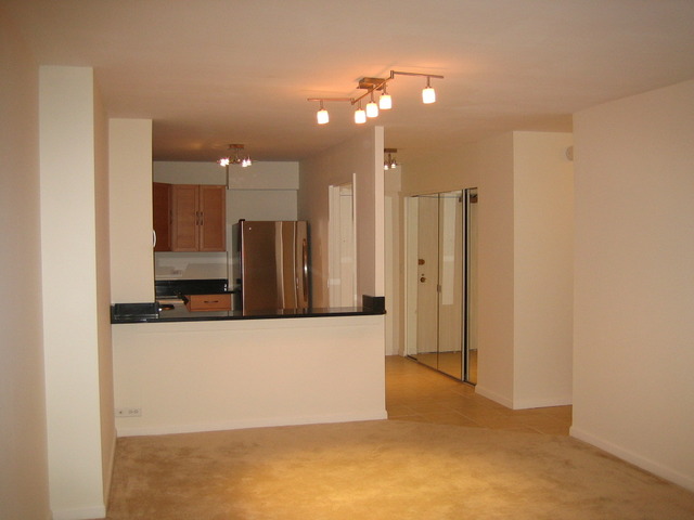 5415 North Sheridan Road, Unit 1715 Chicago, IL 60640 - Photo 3 of 24 a view of a kitchen with a refrigerator