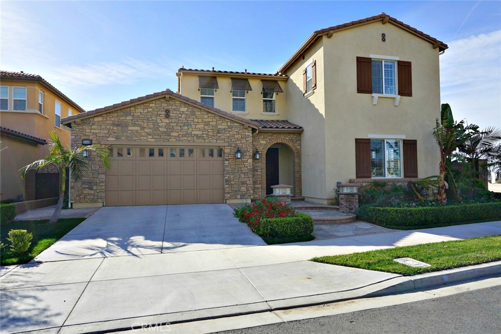 2448 East Roughneck Place Brea, CA 92821 - Photo 1 of 1 a front view of a house with garden