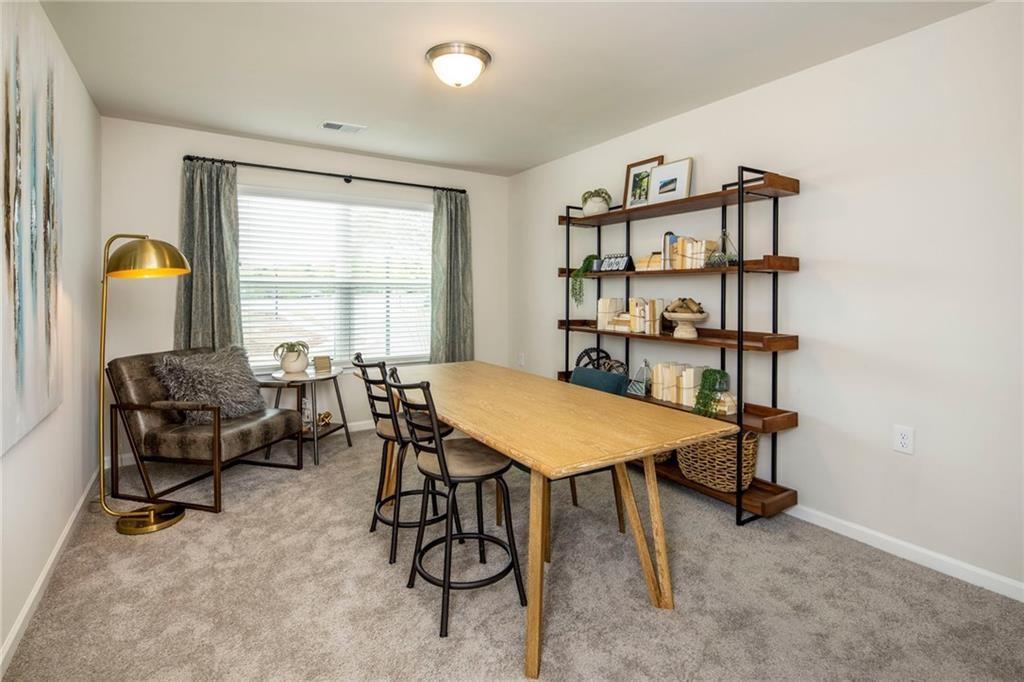 100 Cottage Way, Unit NUTMEG Hampton, GA 30228 - Photo 27 of 44 a view of a workspace with furniture and a window