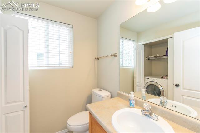 756 Ridgebury Place Fountain, CO 80817 - Photo 13 of 30 Half Bath on Main Floor. Laundry inside Bathroom on Main floor.