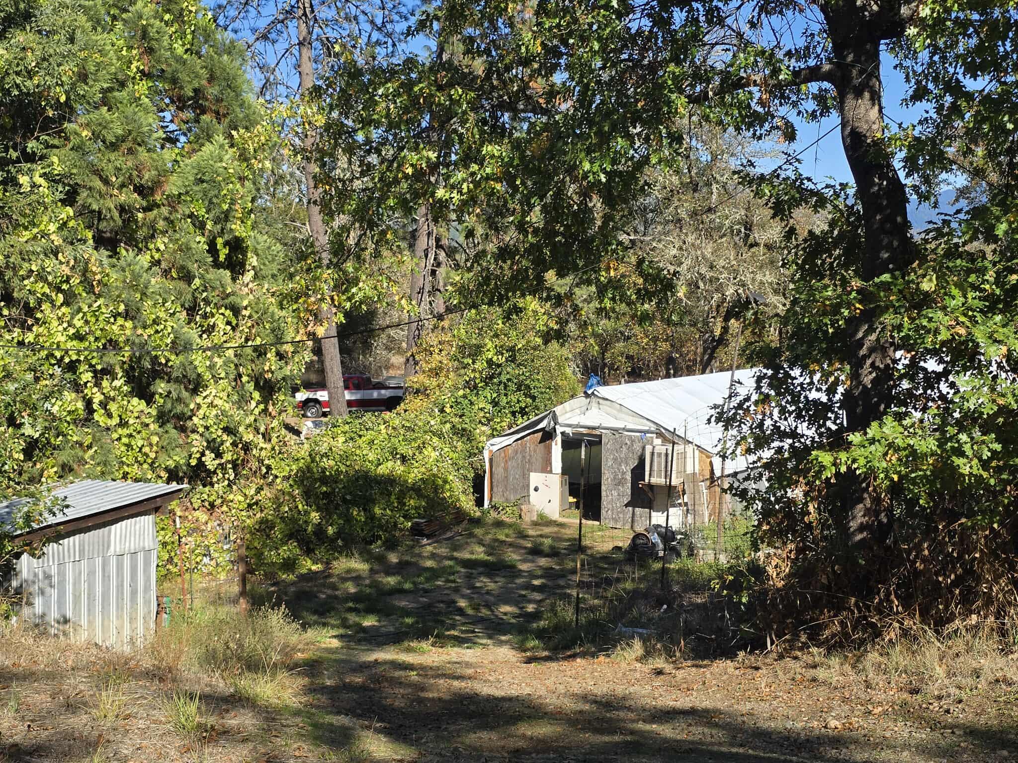 2565 Rockydale Road Cave Junction, OR 97523 - Photo 13 of 14 a house view with a backyard space