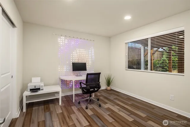 a workspace with furniture hardwood and a window