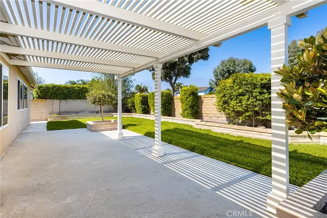 a view of a backyard with swimming pool