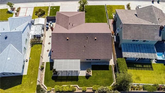 an aerial view of a house with swimming pool