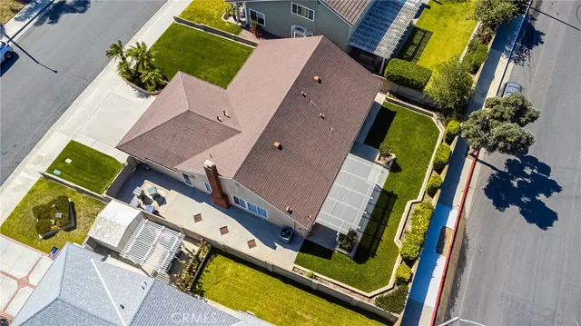 an aerial view of a house with a swimming pool