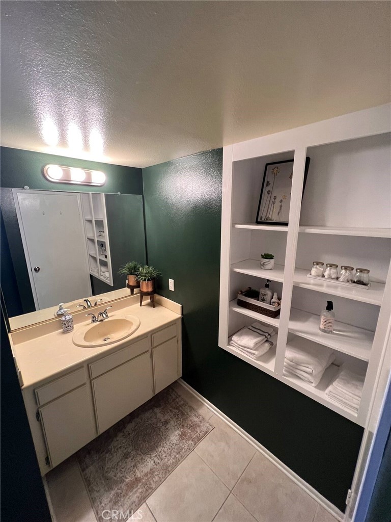 69646 Antonia Way Rancho Mirage, CA 92270 - Photo 34 of 50 a bathroom with a sink and a mirror