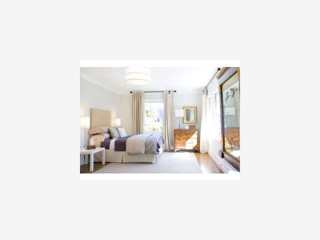 475 Embarcadero Road Palo Alto, CA 94301 - Photo 7 of 9 a living room with furniture and a chandelier