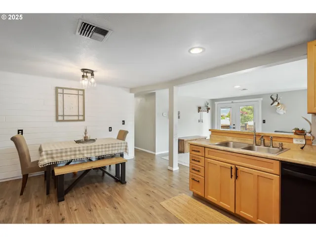 a dining room with a sink and breakfast area