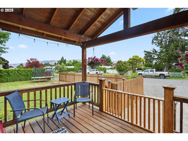 a view of a chairs and table in patio