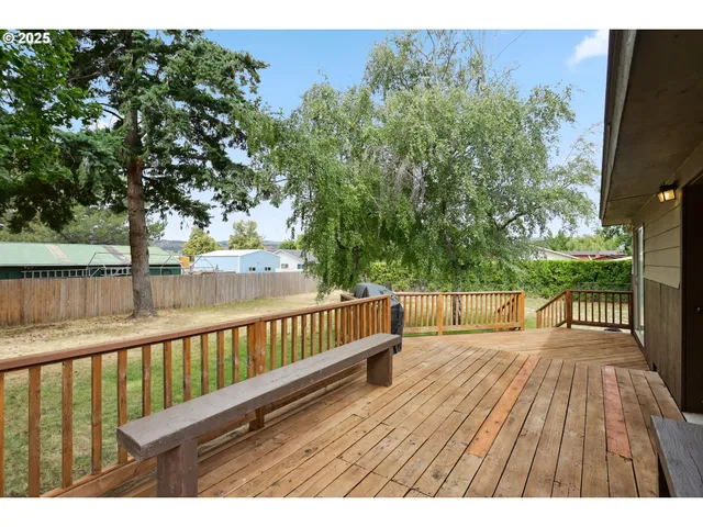 a view of deck with wooden floor and outdoor seating