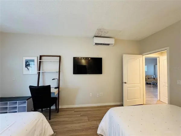 a bedroom with a bed and a chair