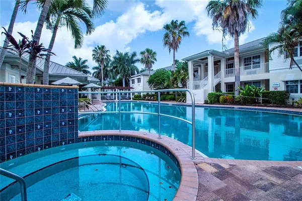 a view of swimming pool with a patio