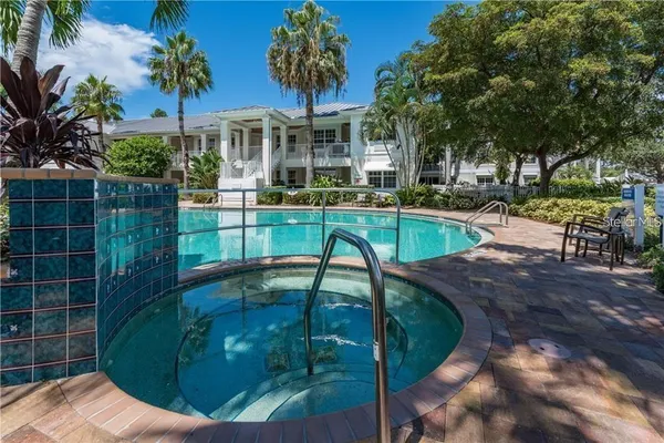 a view of a swimming pool with a patio